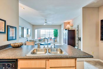 A kitchen with a sink and a window.